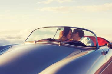 Romantic Couple in a Classic Car