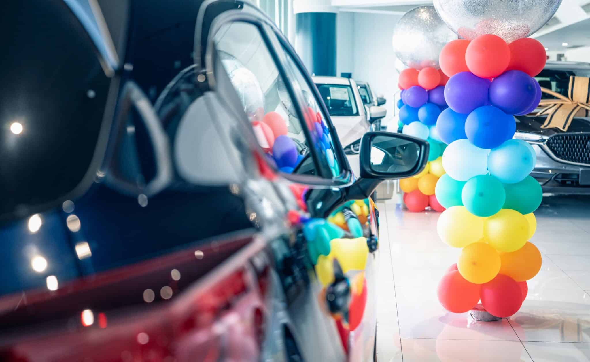 Car dealership showroom—best time to buy a used car.